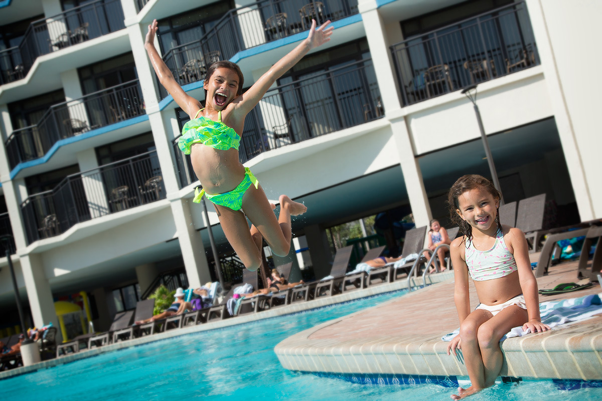 Ocean Reef Girl Jumping In Pool 1200x800 1 