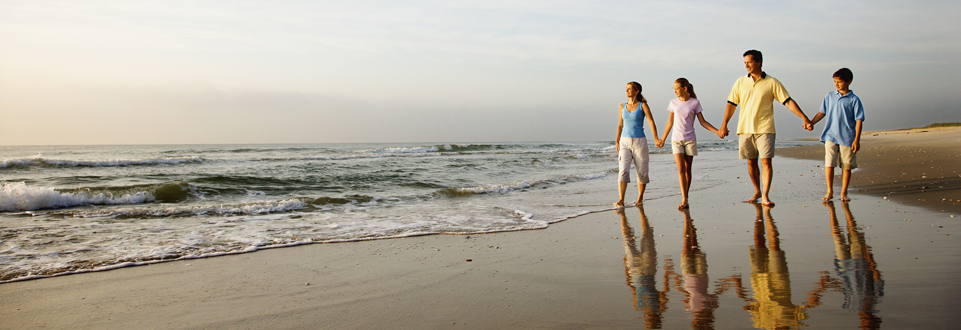 Shore Drive Family Walking On The Beach 1920x660 1 